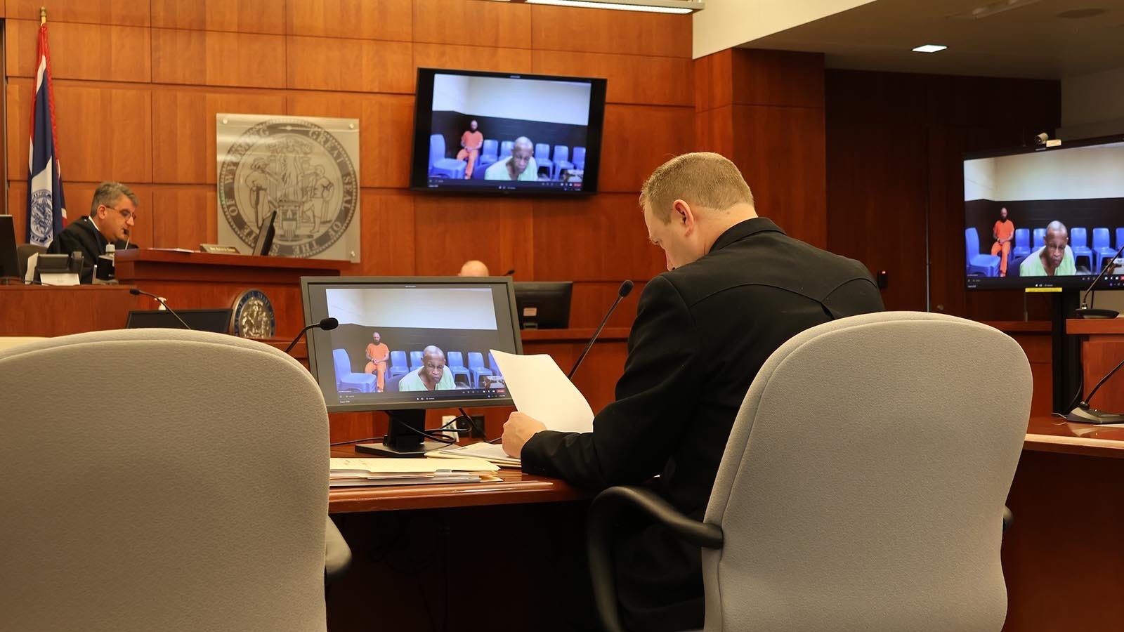 Defendant Paul Hilburn, addresses Casper Circuit Court Judge Kevin Taheri as Natrona County Deputy District Attorney Blaine Nelson listens.