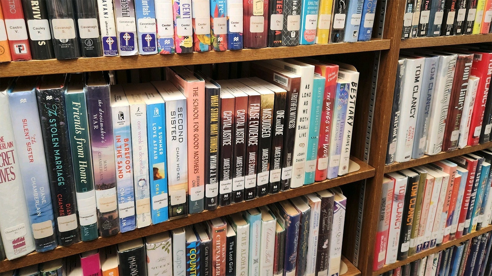 Gillette, Wyoming, Judge Paul Phillips — aka author James Chandler — hand-writes best-selling legal thrillers inspired by his courtroom experiences. His books are being considered for a TV docuseries as his writing career takes off. Here's a section of his books in the Campbell County Public Library.
