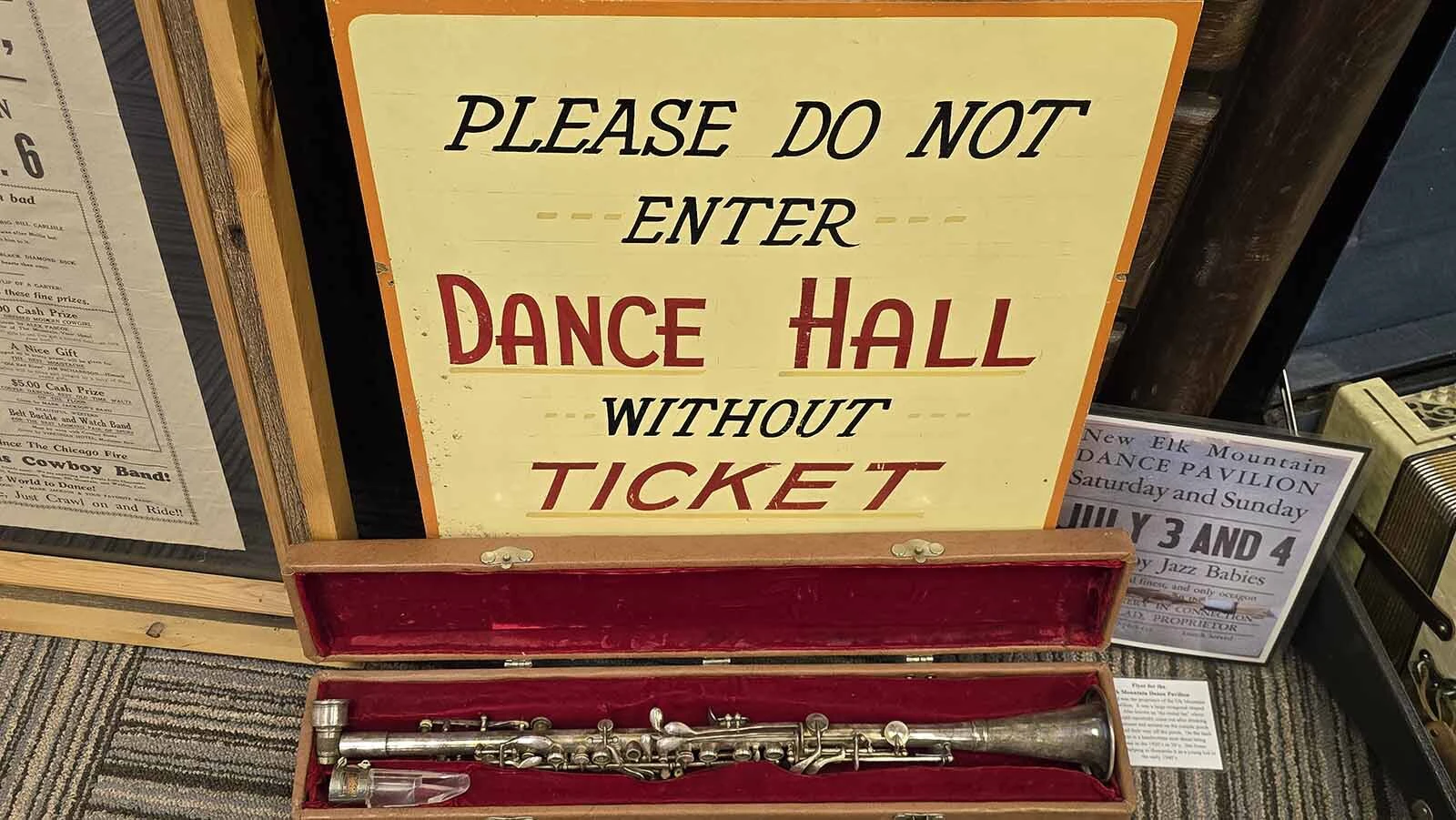One of the signs that was hung at the Garden Spot Pavilion in Elk Mountain, and an instrument from the time period, displayed in the museum at Elk Mountain.