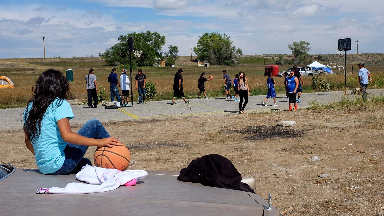 People play basketball on the Wind River Indian Reservation in this undated file photo. Insurance companies believe Native Americans struggling with addiction are being lured from Wyoming to illegitimate treatment facilities in an insurance-billing scam. Legislators are considering laws to help the insurance industry curb the scheme.