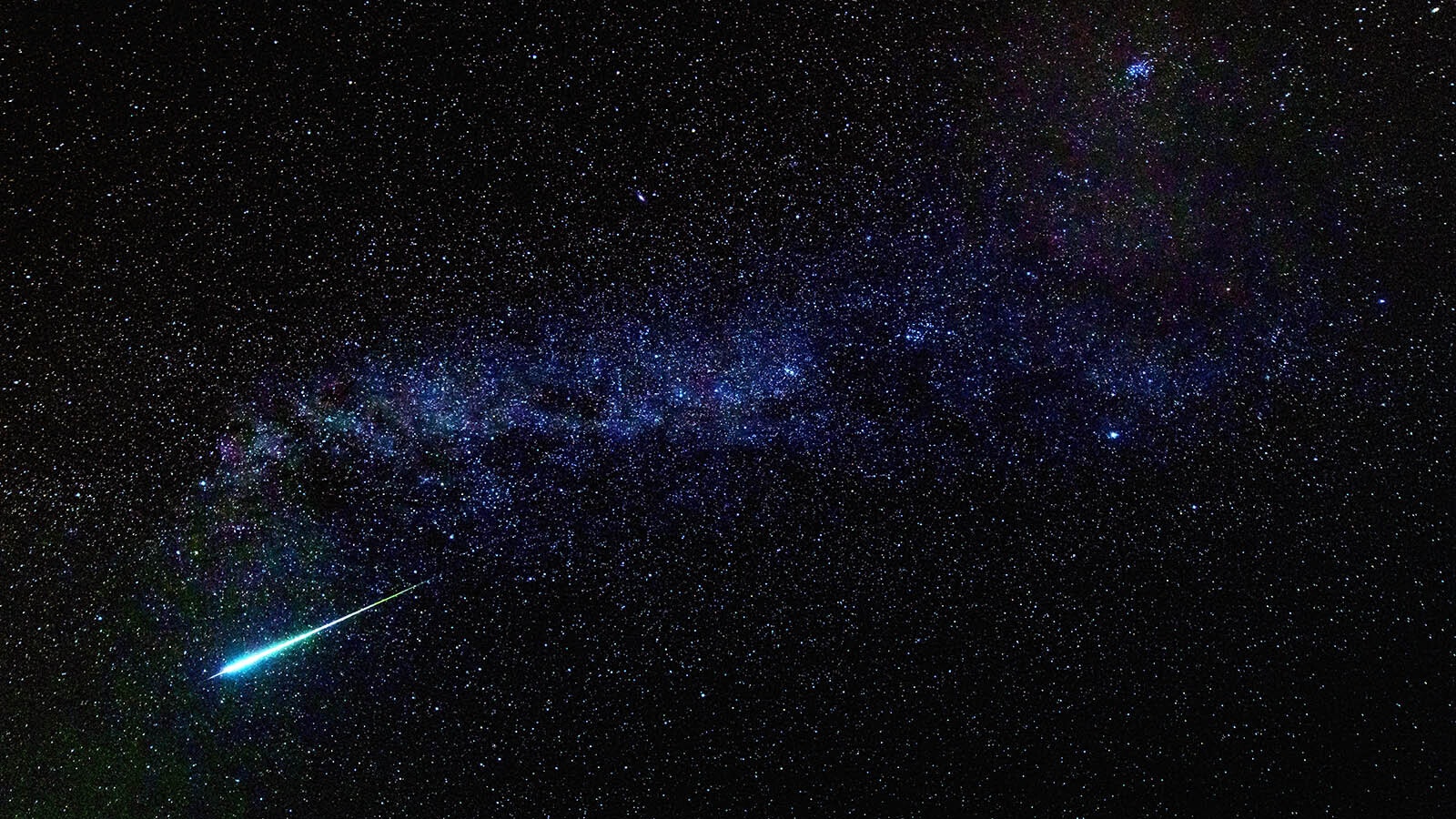 A meteor streaks across the Milky Way during the Perseid meteor shower of 2016.