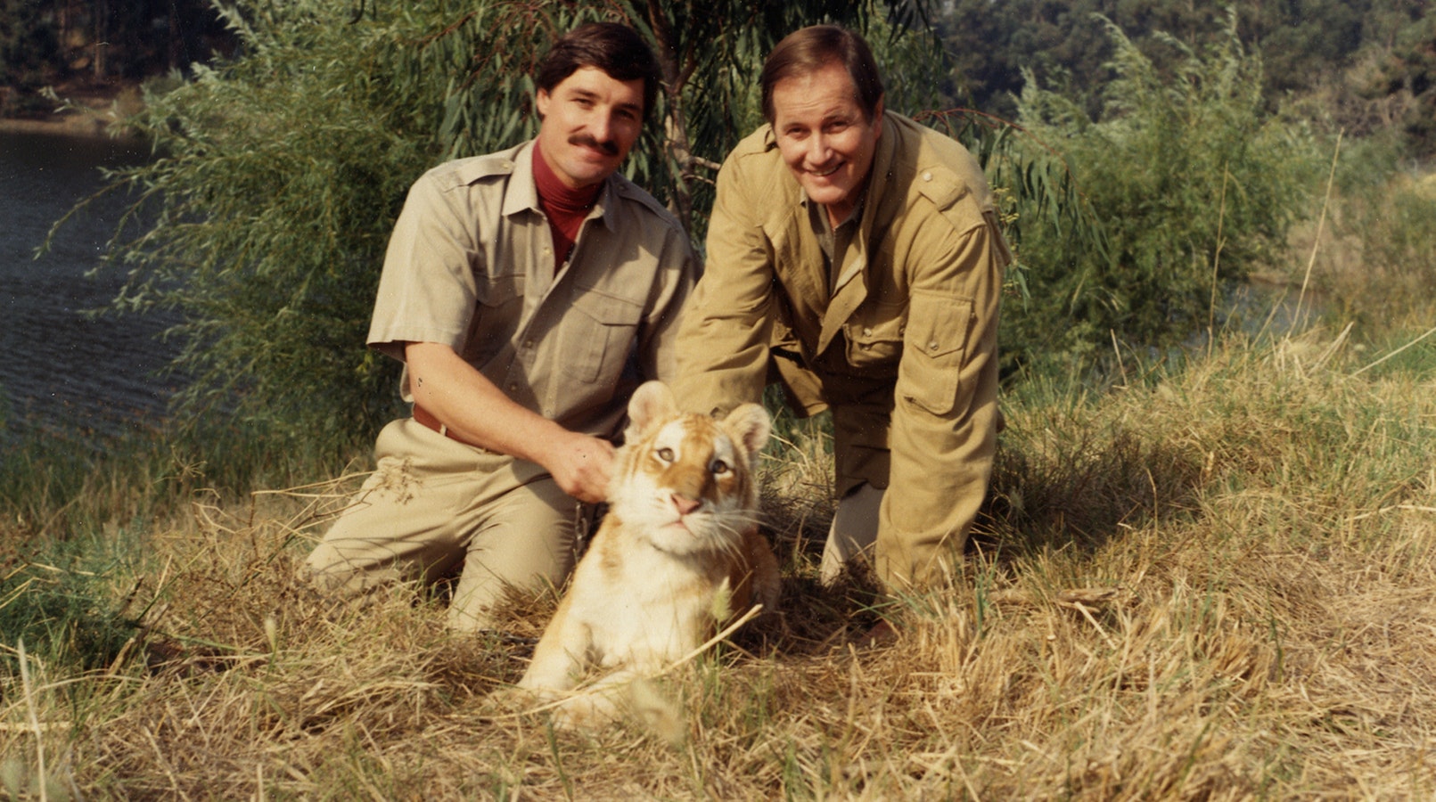 Peter Gros, left, hosts the “Mutual of Omaha’s Wild Kingdom” nature documentary series, now in its 60th year. He follows in the footsteps of legendary hosts Marlin Perkins and Jim Fowler, right.