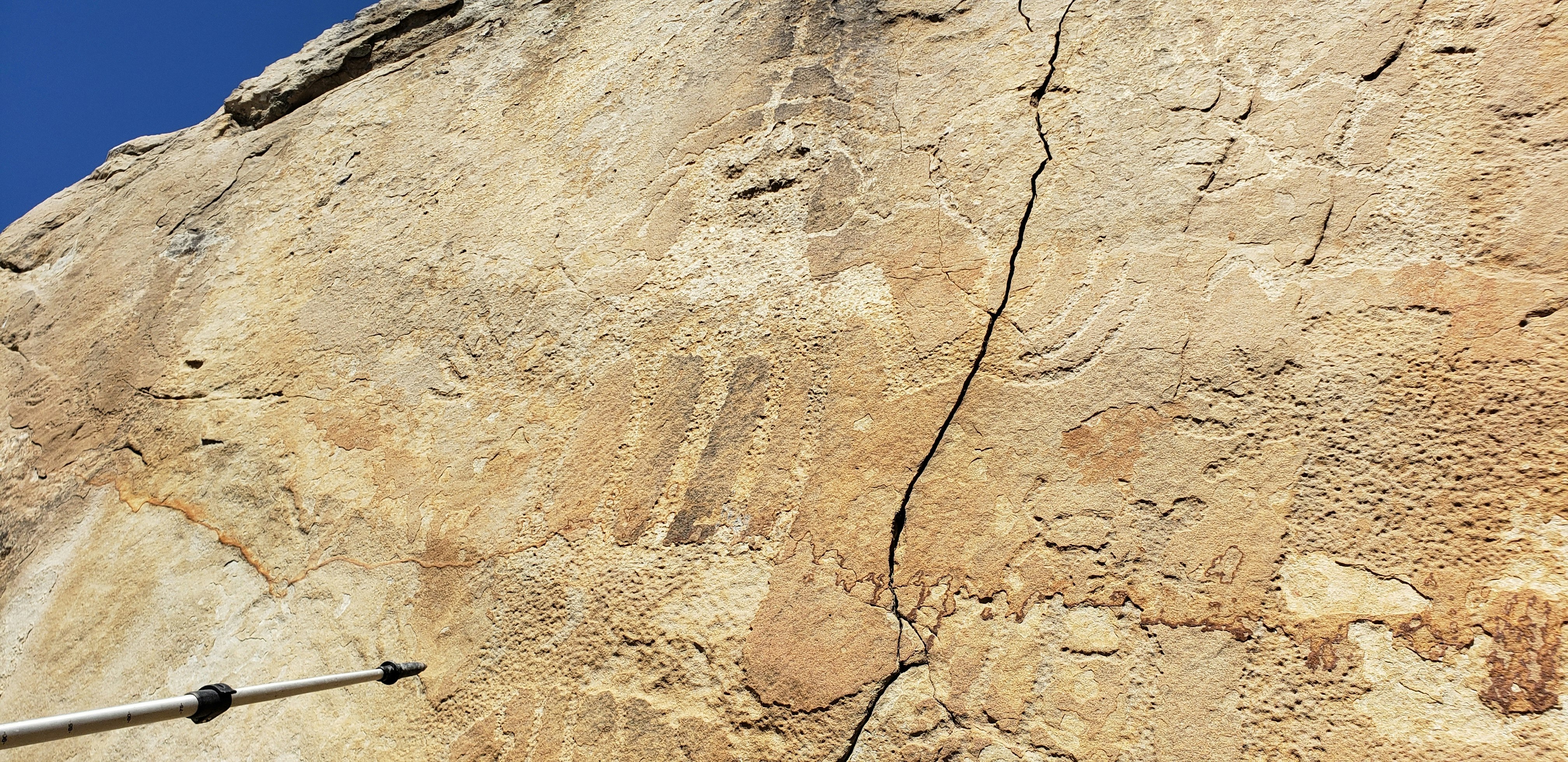 An anthropomorphic petroglyph found on the Wind River Indian Reservation. Time is wearing away the petroglyphs, and some of the rock faces have fallen away as well.