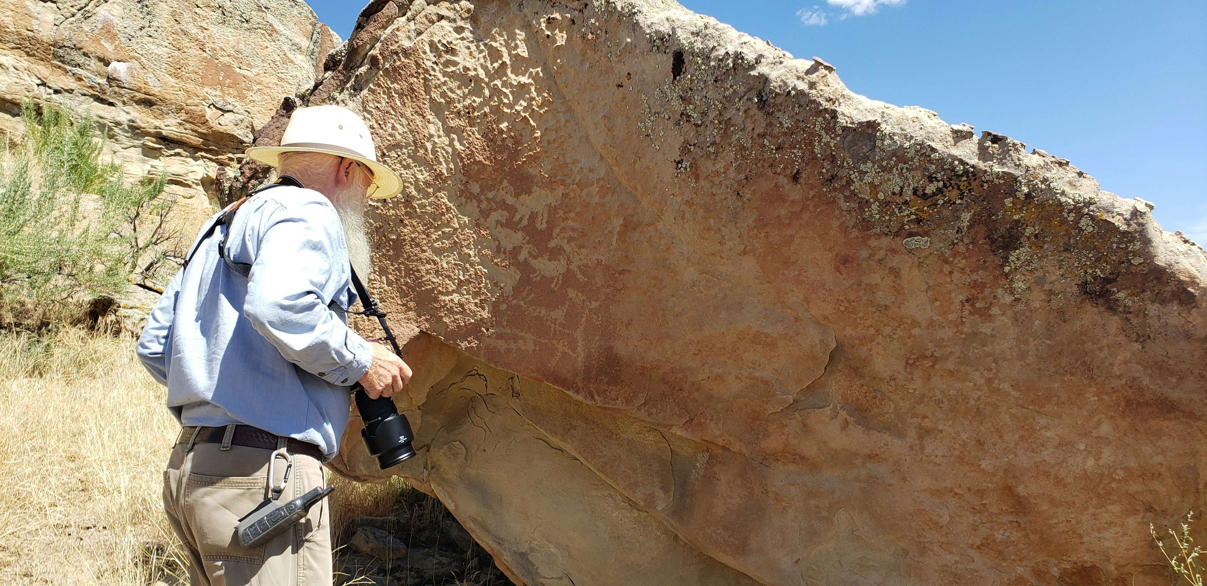 Mike Bies talks about a petroglyph that likely shows a narrative involving sheep on the Wind River Indian Reservation.