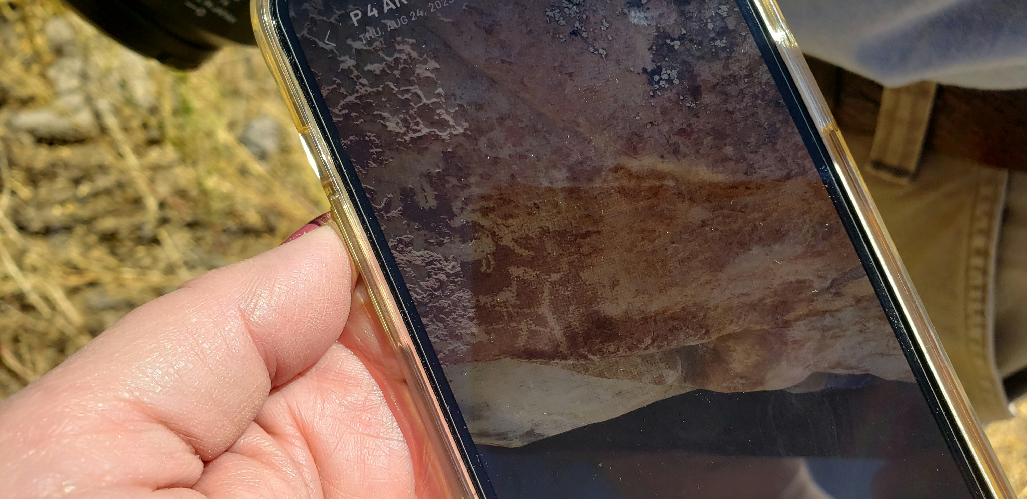 Mike Bies uses a cellphone app to scan petroglyphs. The app can later be used to print 3D models of the petroglyphs.