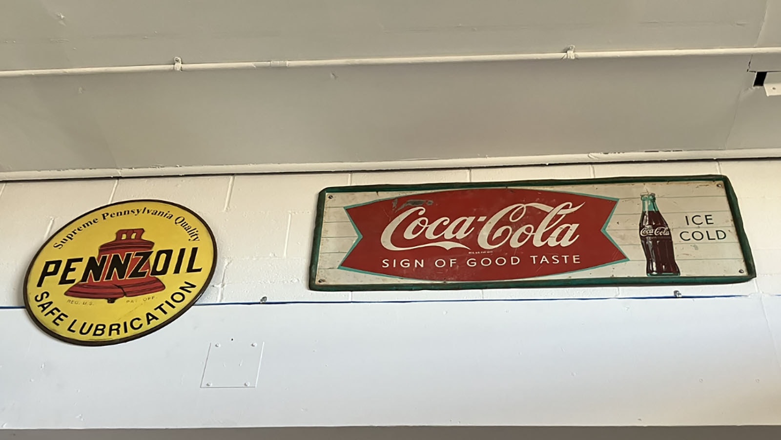 Original Pennzoil and Coke signs from days gone by collected by Joseph Parke.