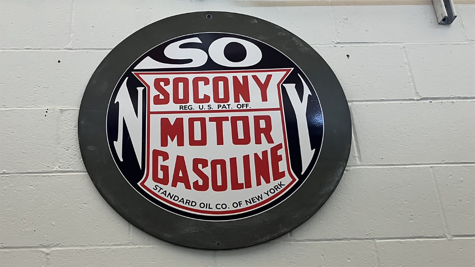 An vintage SOCONY sign collected by Joseph Parke hangs in the bay of the station.