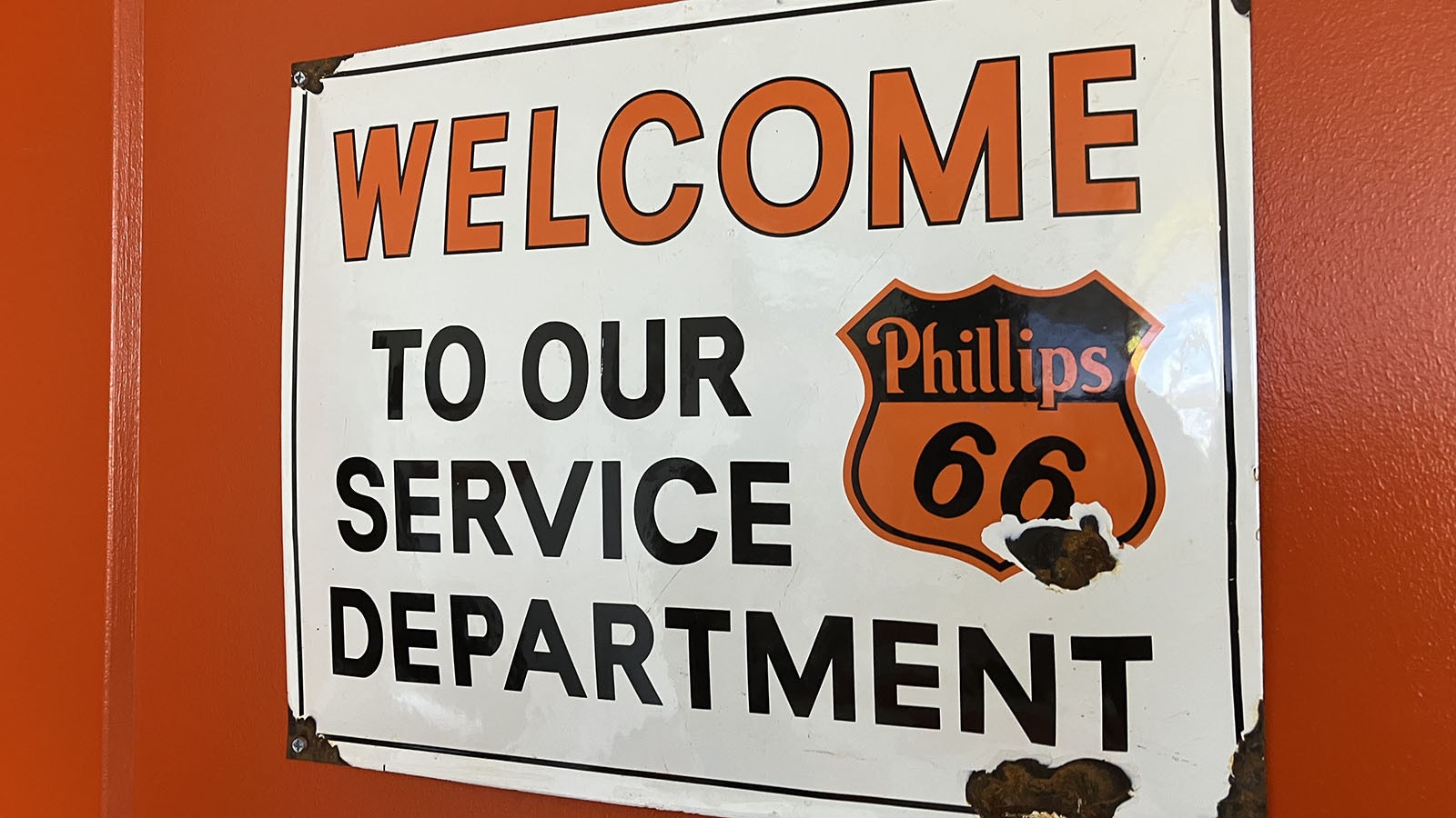 An original Phillips 66 sign welcoming customers to the service department that was collected by Joseph Parke hangs in the restored station.