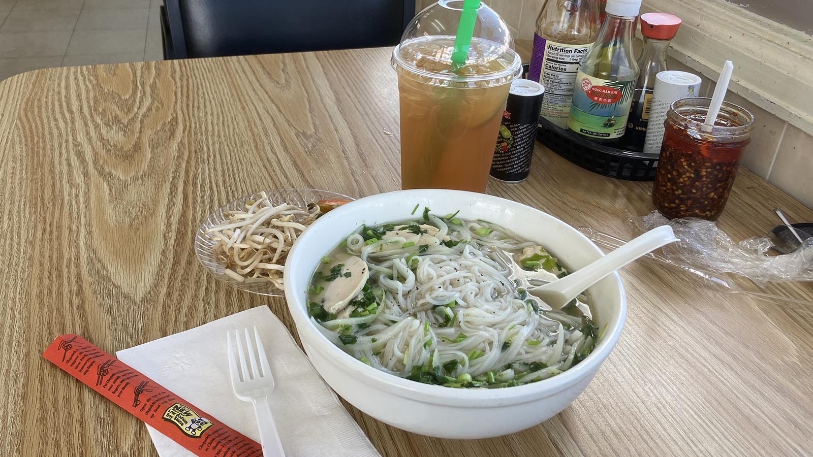 Cowboy State Daily recently tried the Pho Ga dish at Pho Saigon. The pho soups come with hot broth seasoned with spices and herbs filled with rice noodles and a side of bean sprouts, lime and hot peppers that can be added to the soup as desired.