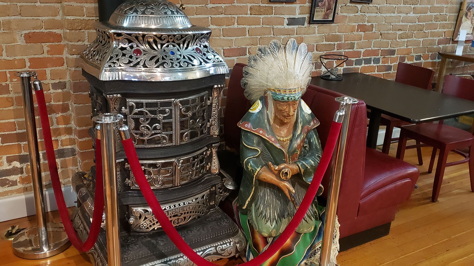 The Indian sitting quietly by the fancy wood stove gets lots of comments from guest at Pie Zanos in Buffalo.
