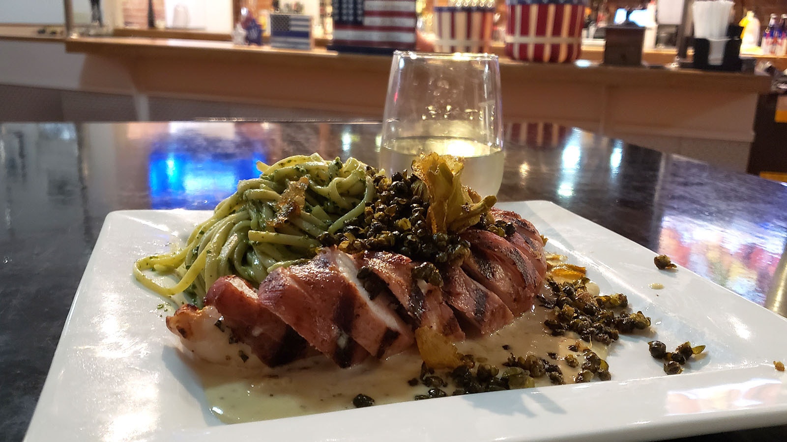 The chicken saltimbocca is what got Guy Fieri's attention. Unlike a typical saltimbocca, the Pie Zanos' version has been turned into a roulade and is served with a nest of pesto linguini with fried capers tossed over all of it.