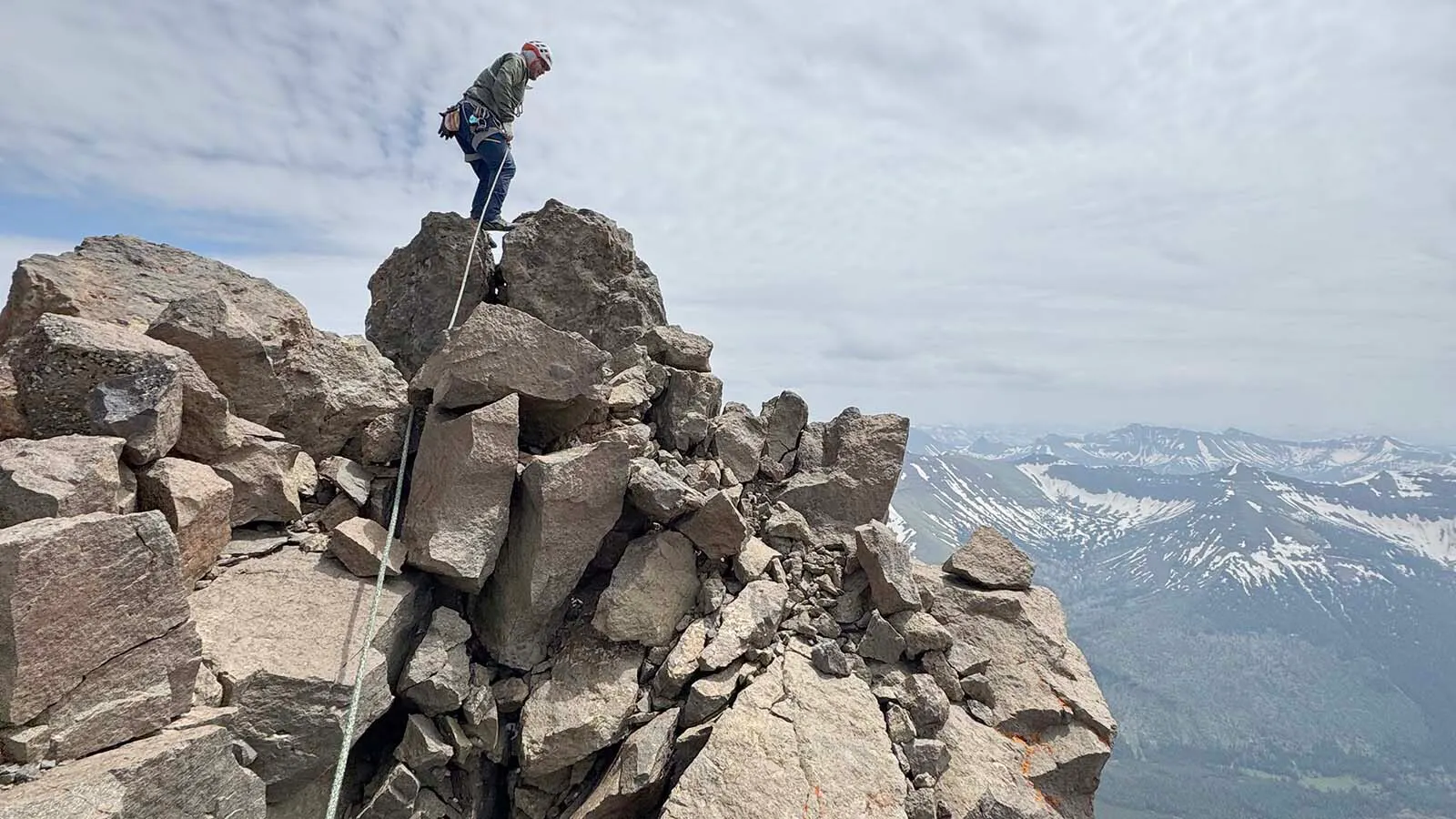 The 11,699-foot-tall Pilot Peak is one of the most famous mountains around Yellowstone, its sharp point making it one of Wyoming’s most recognizable. Known as a “mini-Matterhorn,” it's also one of the state's toughest climbs. This view is a climber high on the east face of Pilot Peak.
