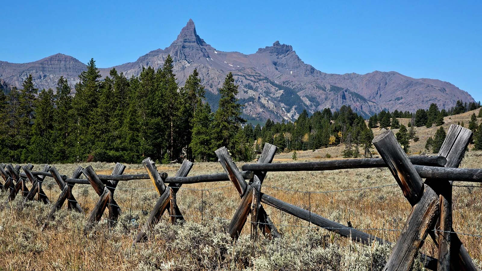 The 11,699-foot-tall Pilot Peak is one of the most famous mountains around Yellowstone, its sharp point making it one of Wyoming’s most recognizable. Known as a “mini-Matterhorn,” it's also one of the state's toughest climbs. 