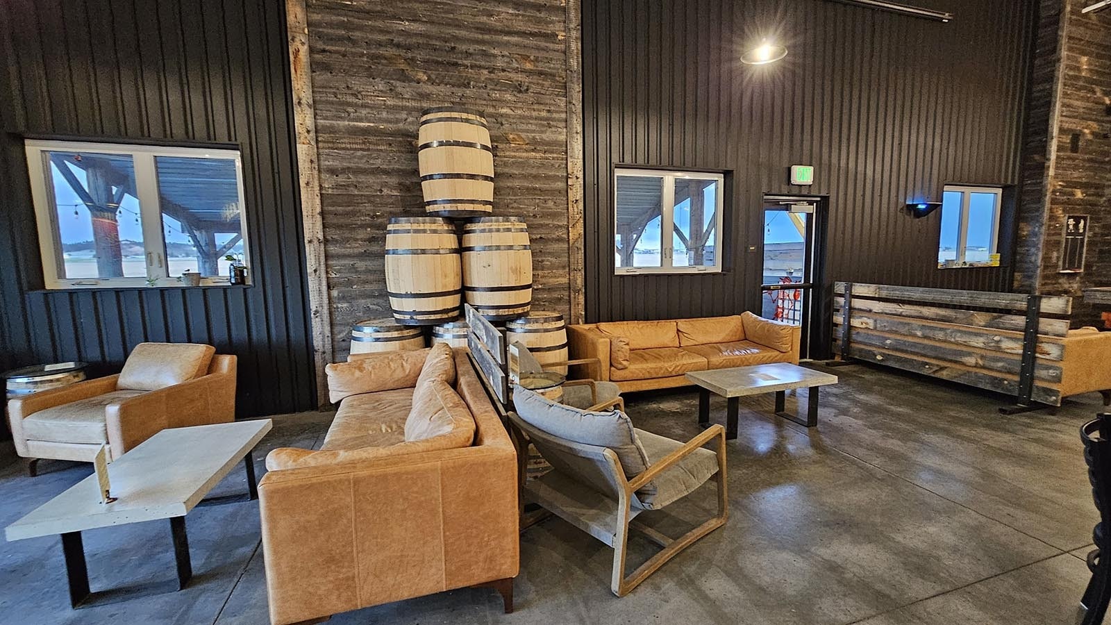 Comfortable seating areas are available for groups in Pine Bluffs Distilling's tasting room.