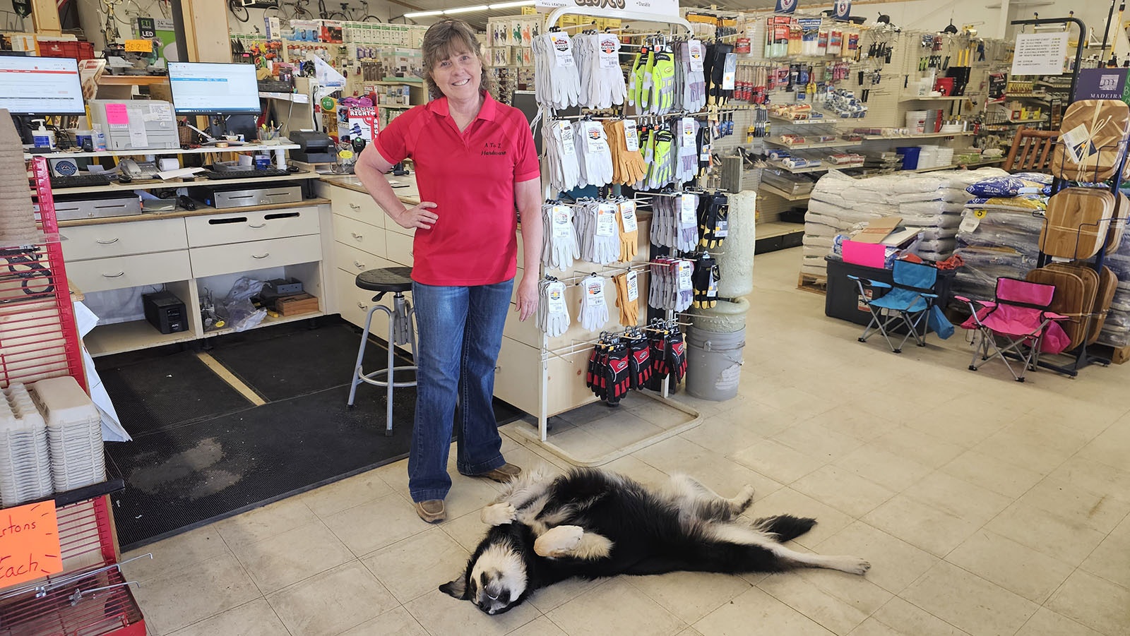 Trish Grove with her dog, Coop, the official door greeter and goofball full of love who works at A to Z Hardware in Pinedale.