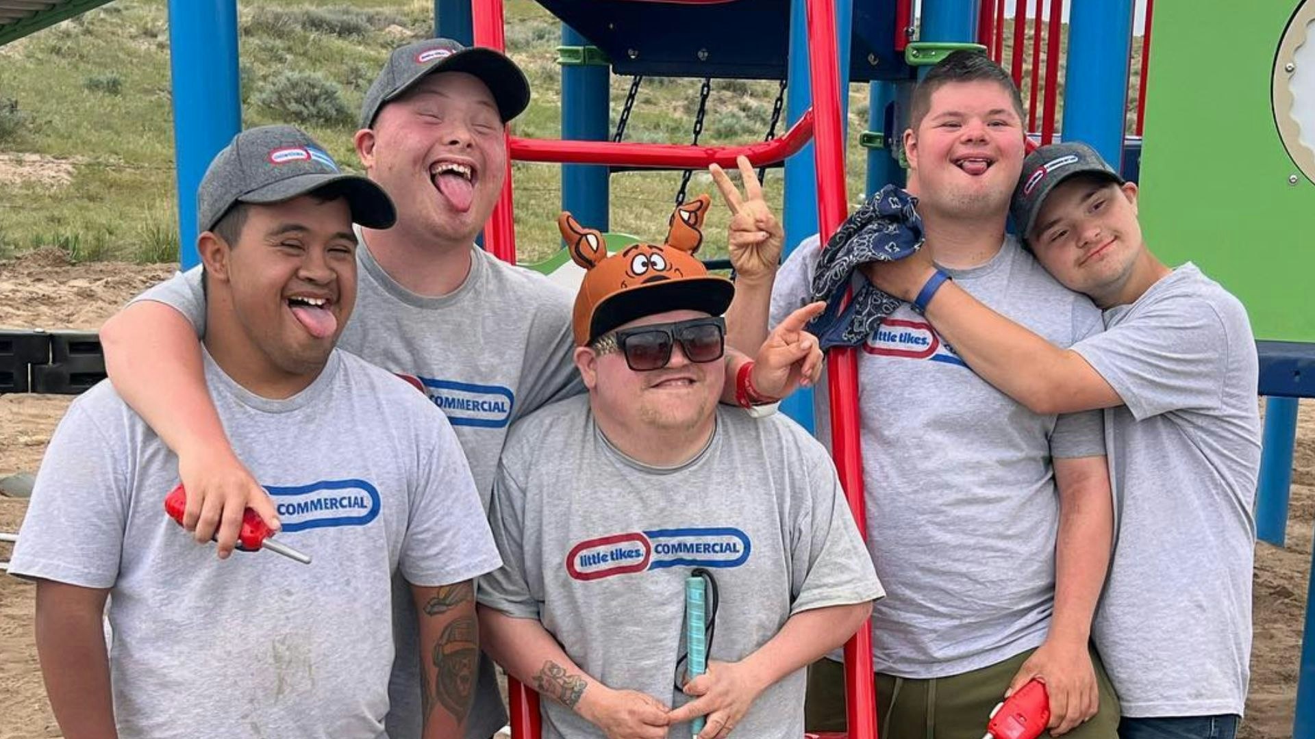 The Pinkerton family of Glenrock, Wyoming, has adopted six kids with Down syndrome. Here are five of them, who were all smiles recently after installing a playground in their backyard.