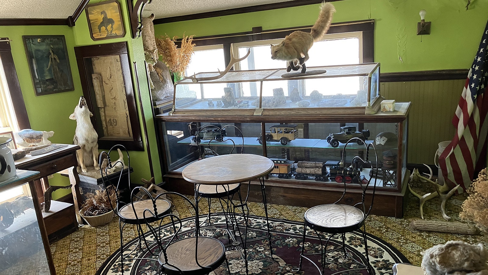 A room in the museum above the Plains Ice Cream Parlor features some taxidermied animals, as well as a display of model cars and a train.
