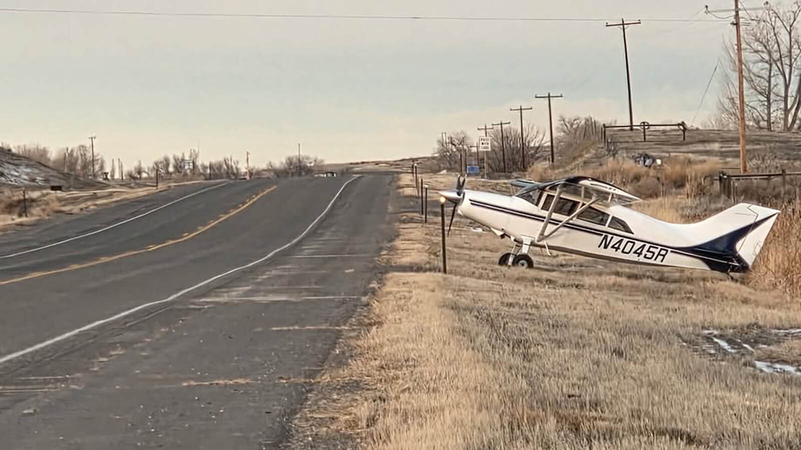 A Wyoming pilot flying to a visit with a doctor ran out of fuel and made a safe emergency landing on U.S. Highway 14 near Greybull. He made his appiontment, then after refueling, authorities blocked traffic so he could take off and return home.