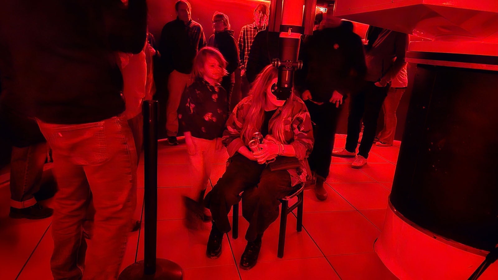 Page Sondrup takes a turn looking at a star in the 1-meter telescope at Snow King's new Planetarium, after her son, left, Harvey, took a turn.