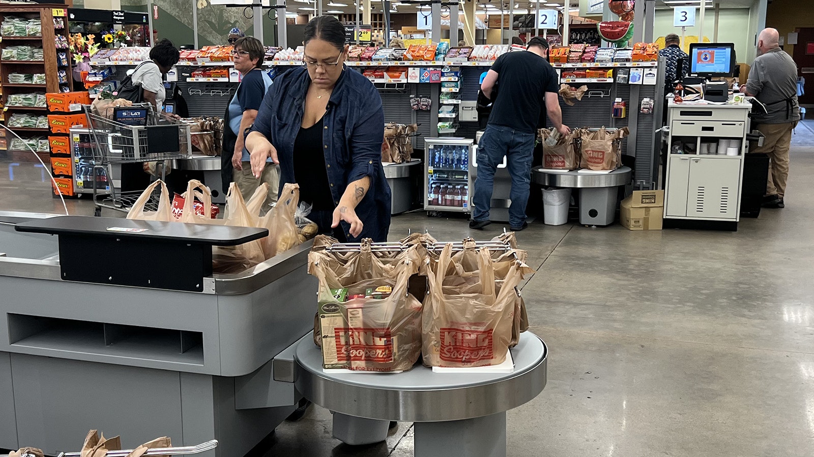 Shari Worley of Cheyenne bags her groceries at a self checkout lane at the Cheyenne King Soopers store in this 2023 file photo.