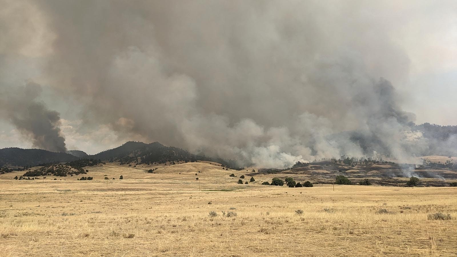 Firefighters continue to battle Wyoming largest active wildfire, the 26,000-acre Pleasant Valley Fire near Hartville just north of Guernsey. As of Saturday morning, it was 30% contained.