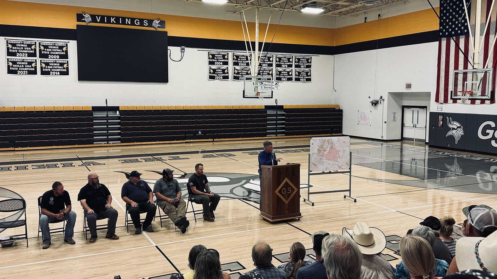 Wyoming Gov. Mark Gordon tells more than 200 people who showed up at the Guernsey-Sunrise High School that more resources are needed to fight wildfires in Wyoming.