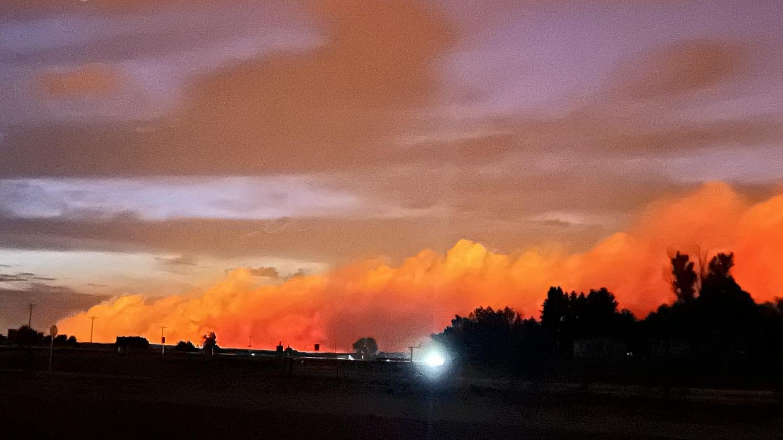 The combined Pleasant Valley and Haystack fires glows ominously weat of Fort Laramie, Wyoming.