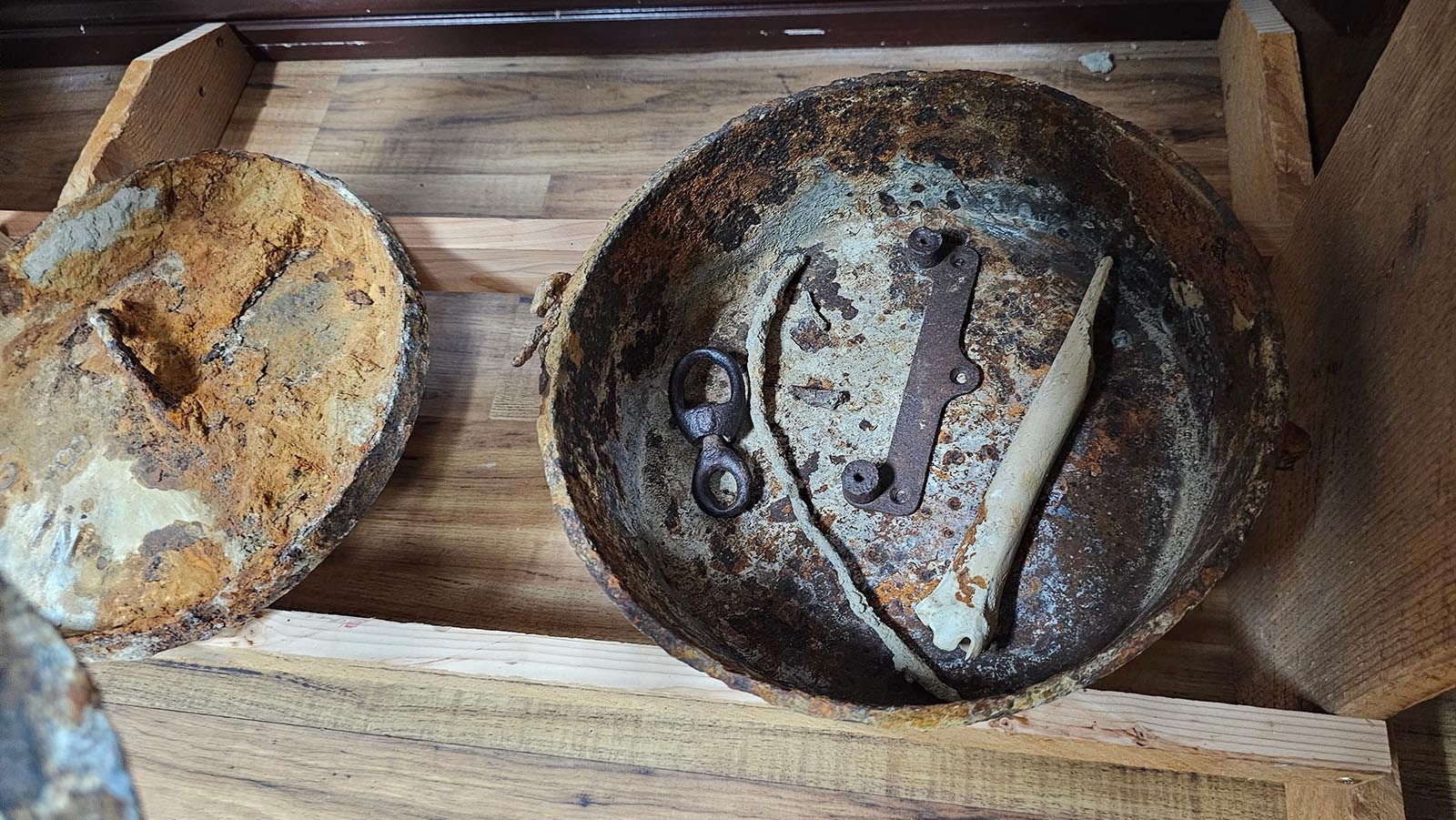 This dutch oven was found sitting on top of a leather saddle, hidden in a cave near Adobe Town. A bone was still inside the Dutch Oven suggested there may have been some haste involved in leaving these objects behind.