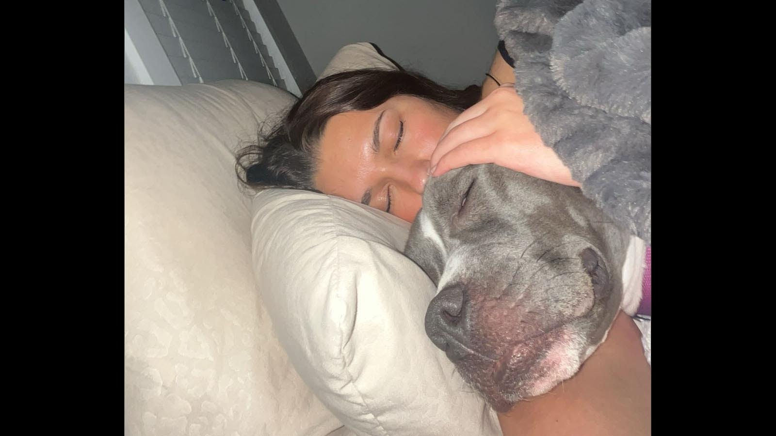 Hallie Blake with her pit bull pup Lily, who had to be put down after being poisoned with antifreeze.