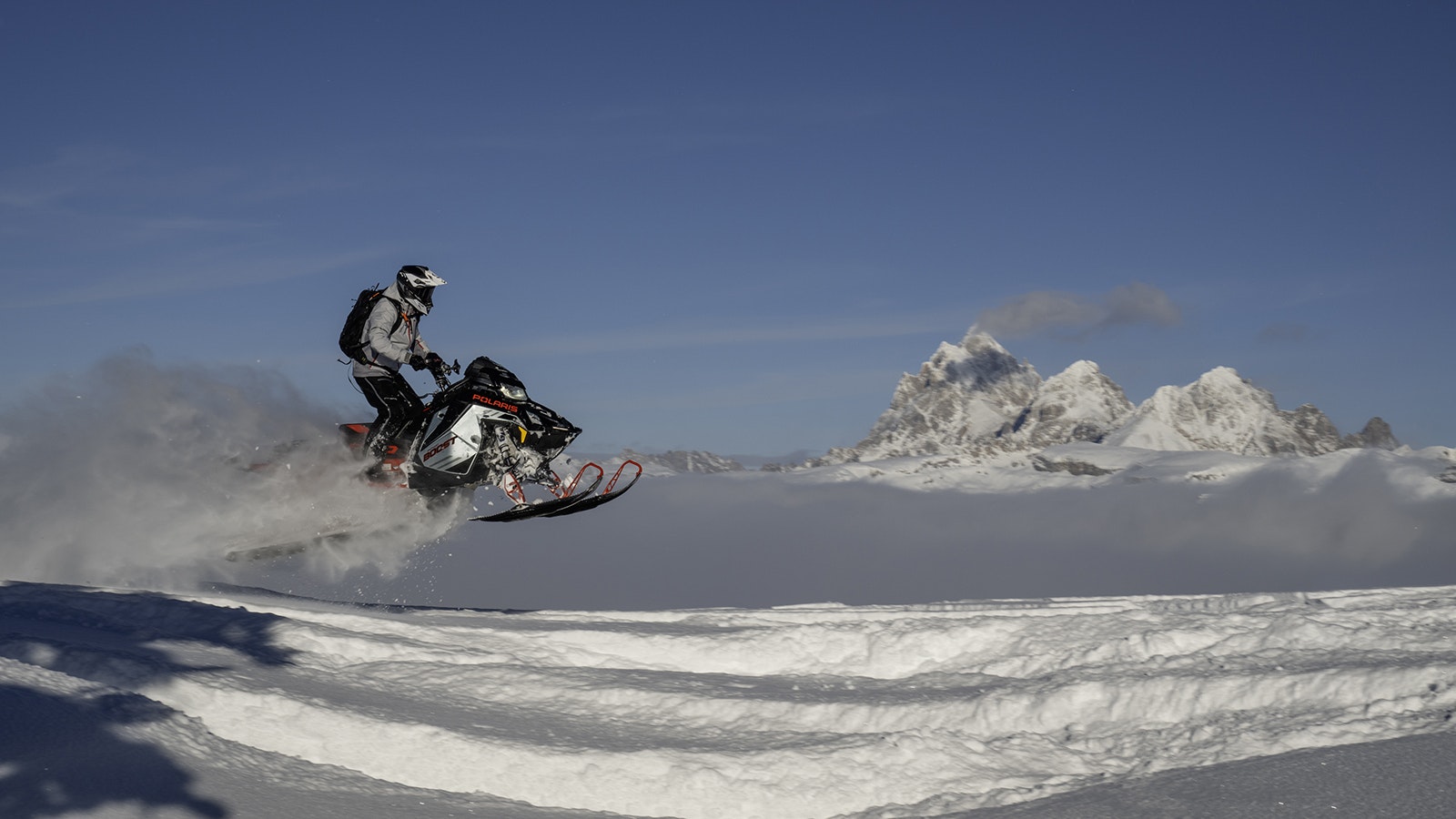 Polaris is promoting its latest lineup of snowmobiles by putting them through their paces in the pristine snow of Wyoming’s Teton Range. The company uses the Cowboy State to showcase the machines as the ultimate toy for backcountry adventure.