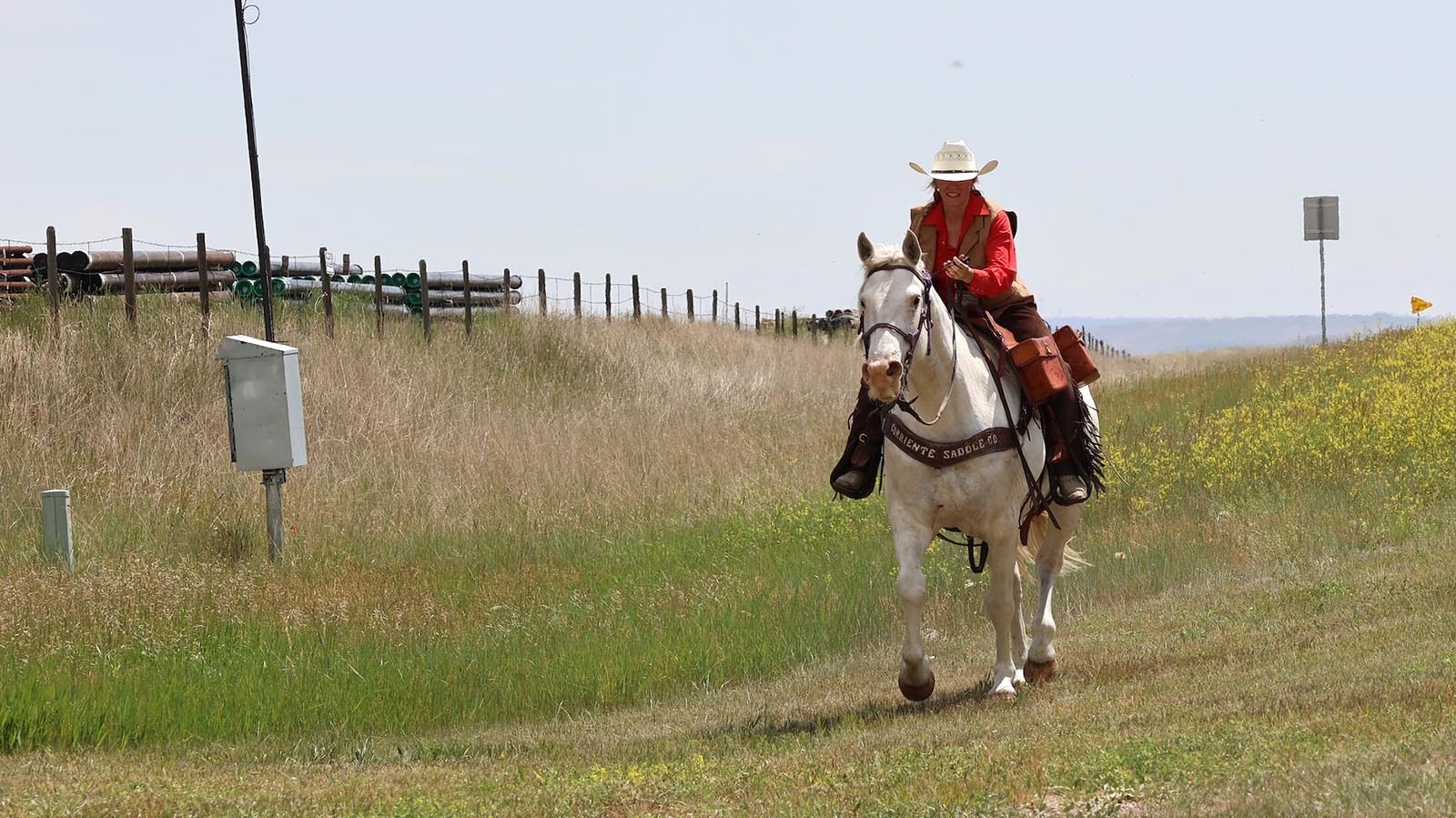A rider between Glenrock and Casper covers her two miles of ground as part of the National Pony Express Association’s 2024 re-ride.
