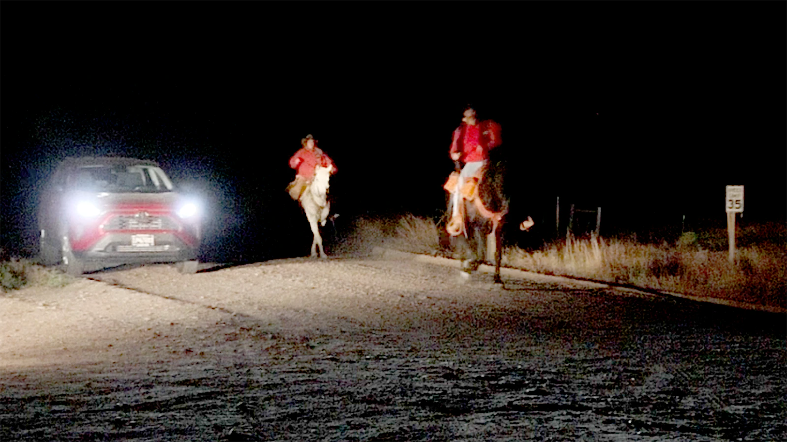Stephanie and Tony Goulart deliver the mail to the old Fort Laramie Bridge handoff site early Friday morning.