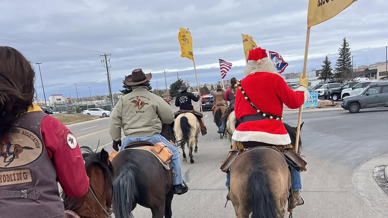 Members of the Sweetwater County Chapter of the National Pony Express Association bring mail into Rock Springs on Saturday.