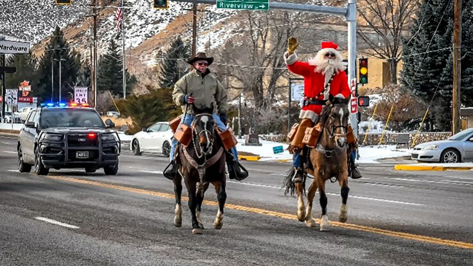 Santa takes the reins for the Sweetwater County Chapter of the National Pony Express Association to get Christmas cards delivered. Riding with him is Fred Leslie, first vice president of the National Pony Express Association.