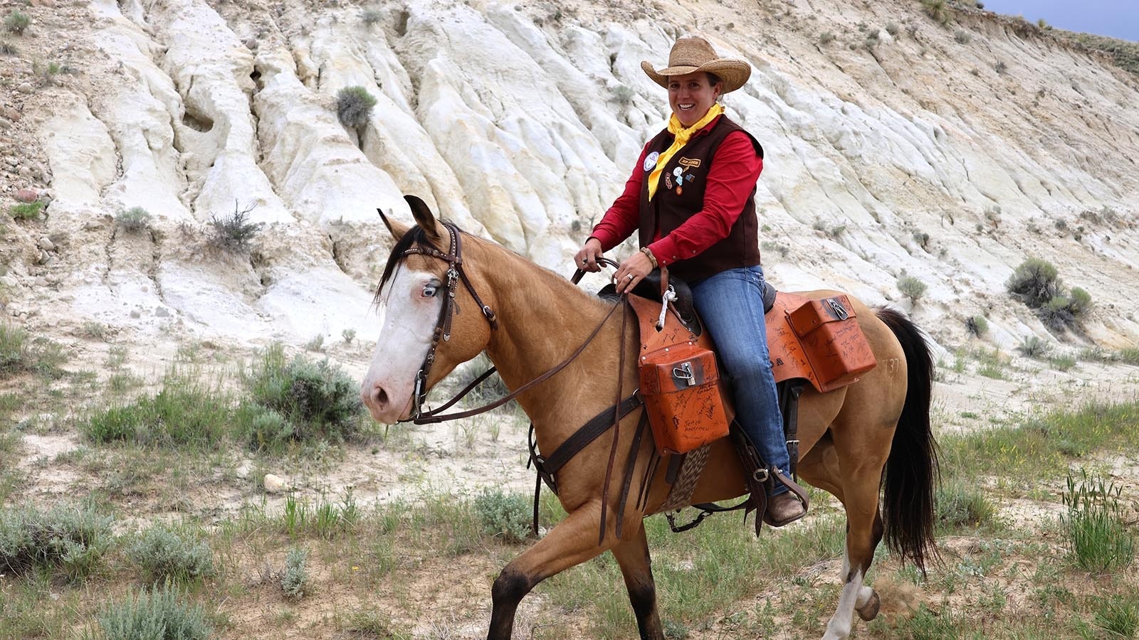 Carly Brown of Golden, Colorado, takes a leg of the re-ride along private ranch land on Oregon Trail Road in central Natrona County.