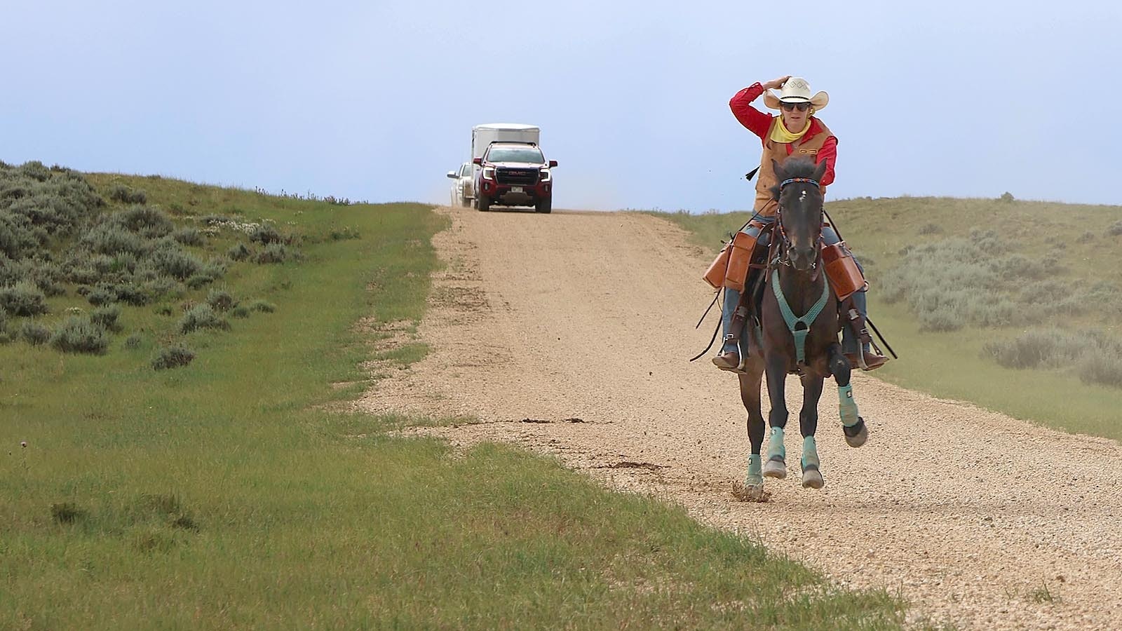 A rider from the Central Wyoming Division of the Wyoming Pony Express Association gallops down Oregon Trail Road west of Casper as weather starts to close in on the group.