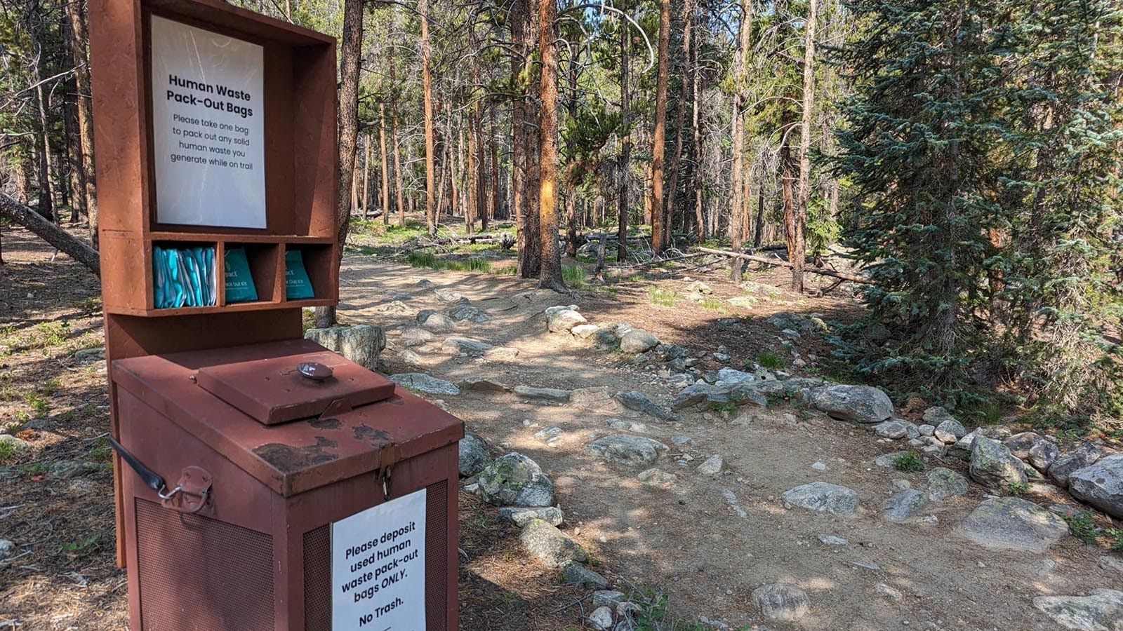 A station with bags for people to pick up and pack out their poo while hiking on Mount Elbert in Colorado, the second tallest peak in the Lower 48.