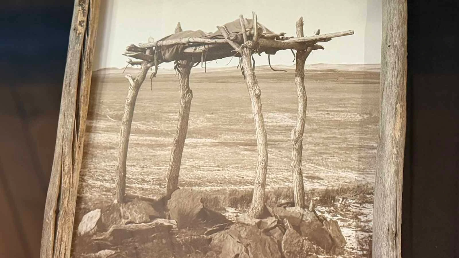 An example of a Plains Indian scaffold burial, in which the deceased was placed on a raised wooden platform. Stones were sometimes placed around the base of the supporting posts. This is what Bob and Larry Edgar believed was on top of Pappy-Po Butte. In addition, a literate English-speaker carved the year 1811 into sandstone with a dedication to those that died. 