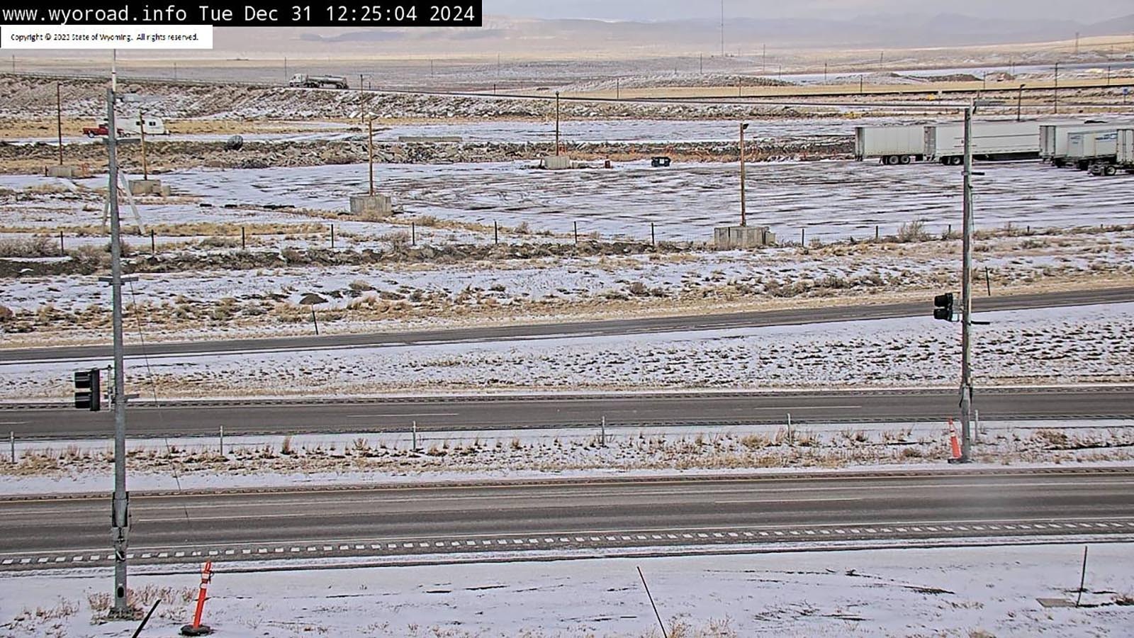 A view of the semi truck parking lot near Sinclair along I-80 from a webcam without any obstruction.