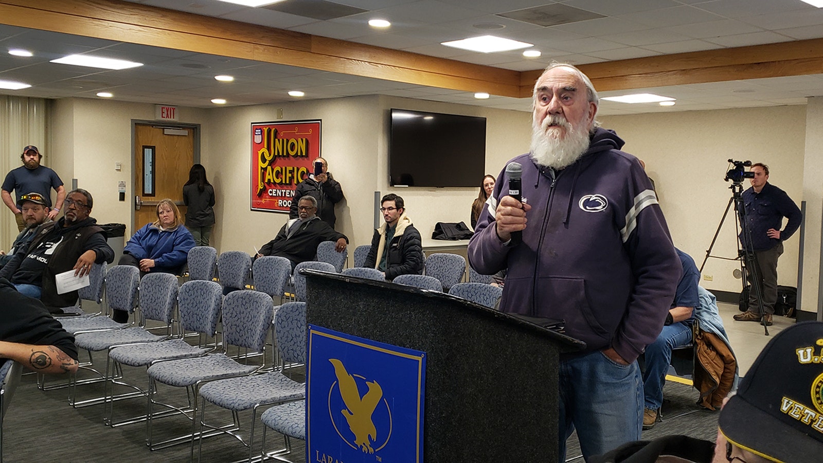Barry Cole of Encampment questions the necessity of proposed changes to the U.S. Postal Service in Cheyenne and said he doesn't believe mail will arrive any faster if it has to go to Denver first.
