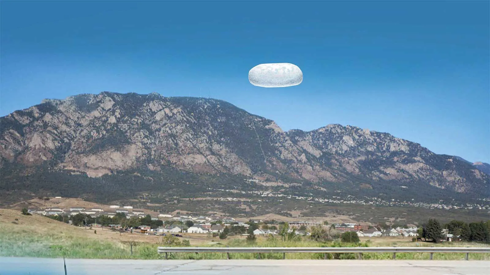 This image is an artistic interpretation of a 2022 incident potentially involving an unidentified flying object (UFO) reported near Colorado Springs. This image is derived from the first-hand narrative description contained in an FBI report that has recently been released.
