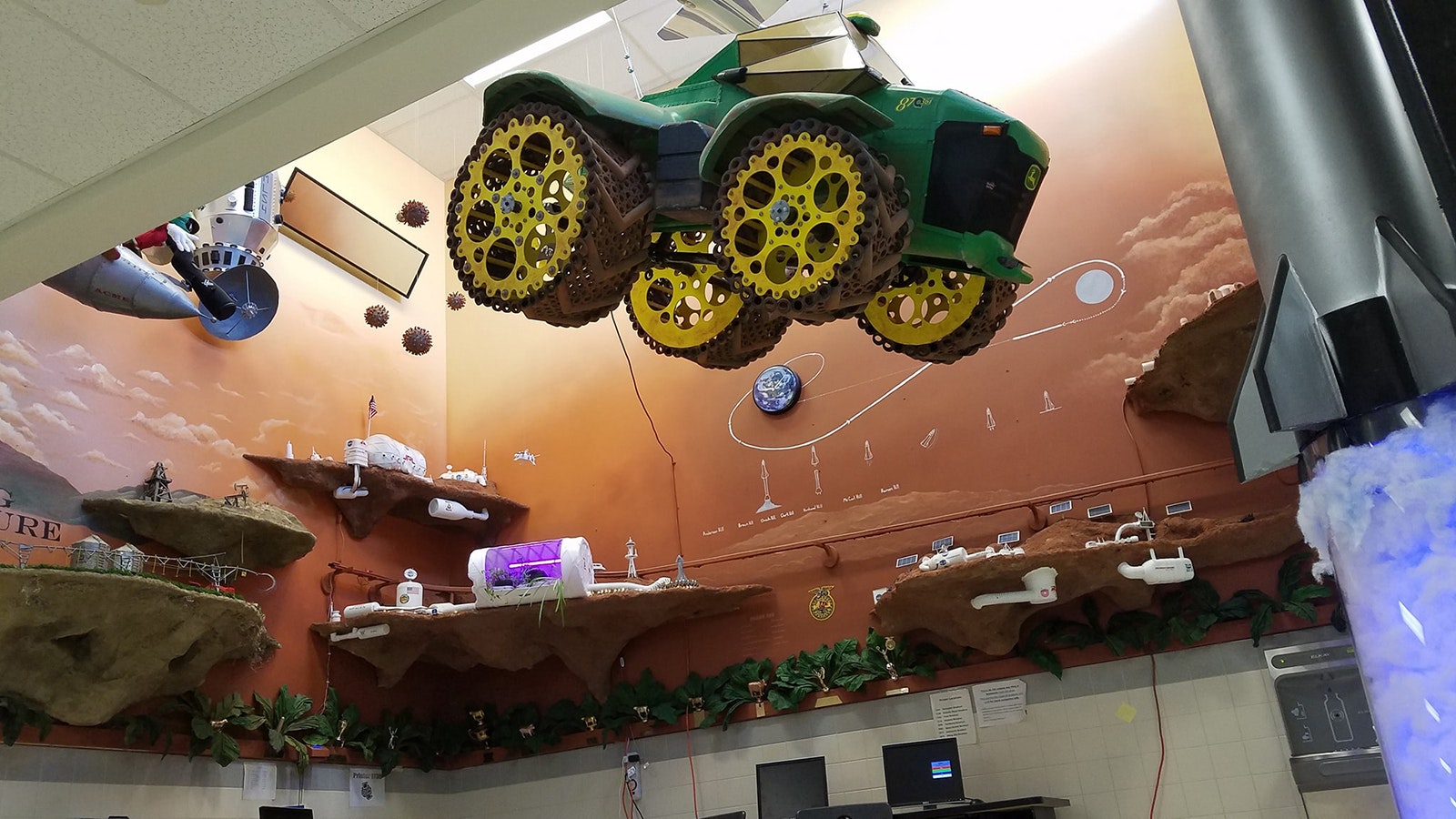 A space tractor hangs in the Mission to Mars display.
