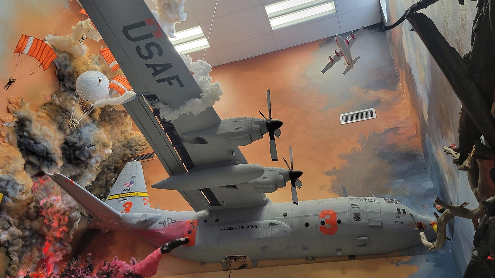 Smoke Jumpers can be seen as an airplane works to put on a fire in one of the displays.