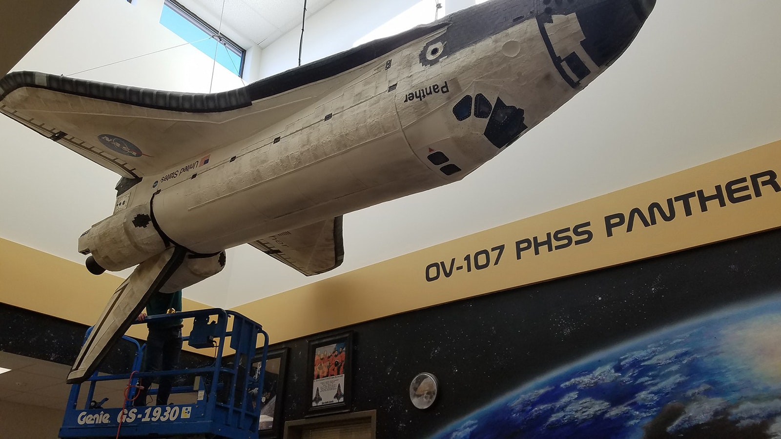 A one-seventh scale space shuttle includes doors that open and close.