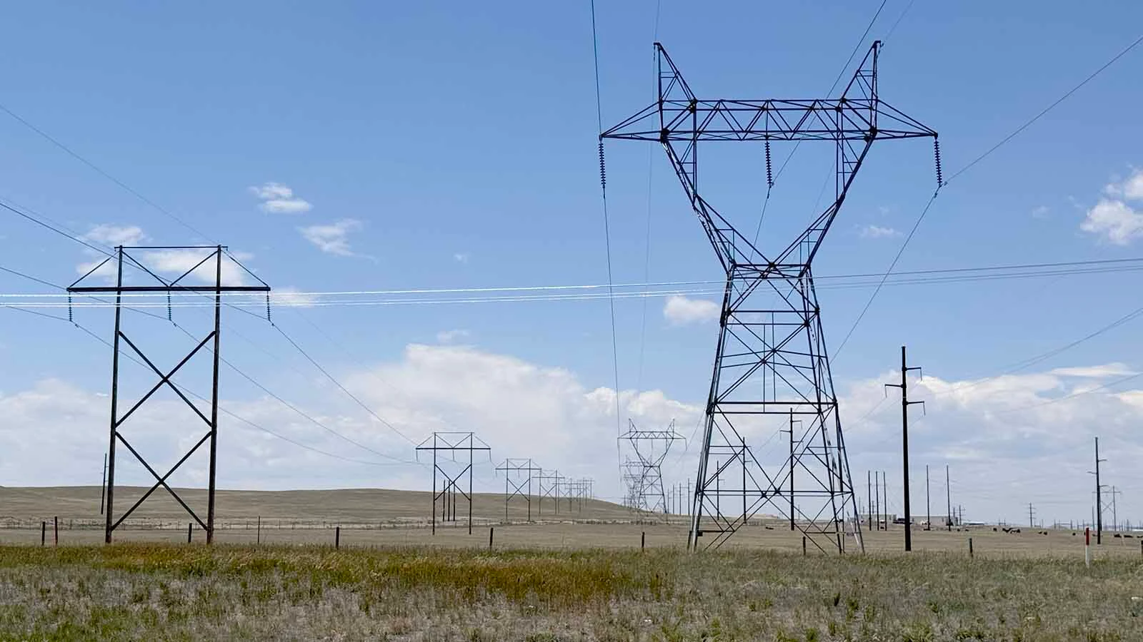 Power transmission lines south of Cheyenne along U.S. Highway 85 running through the Project Jade AI data center development.