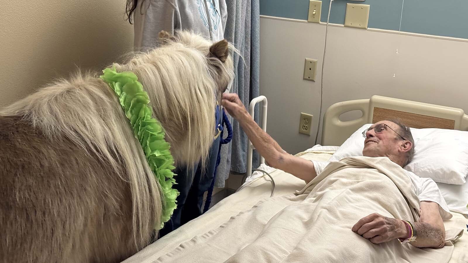 A new resident at the Long Term Care Facility at Cody Regional Health enjoys spending time with a therapy pony.