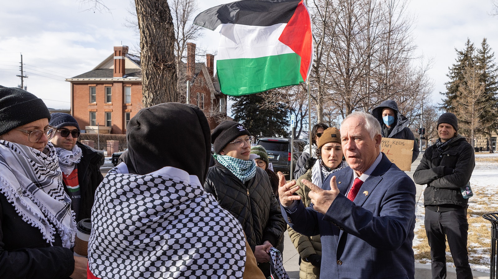 State Rep. Bill Allemand, R-Midwest, talks with a small group of pro-Palestine protesters gathered at the Wyoming State Capitol on Monday.
