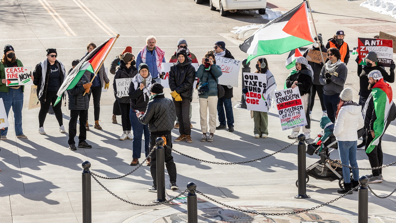 A small group of pro-Palestine protesters gather at the Wyoming State Capitol on Monday to demand a cease-fire in the war between Israel and Palestine.