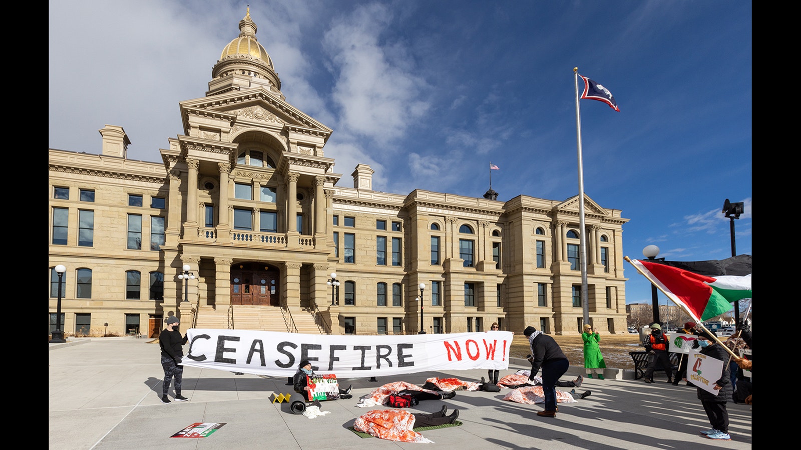A small group of pro-Palestine protesters gather at the Wyoming State Capitol on Monday to demand a cease-fire in the war between Israel and Palestine.