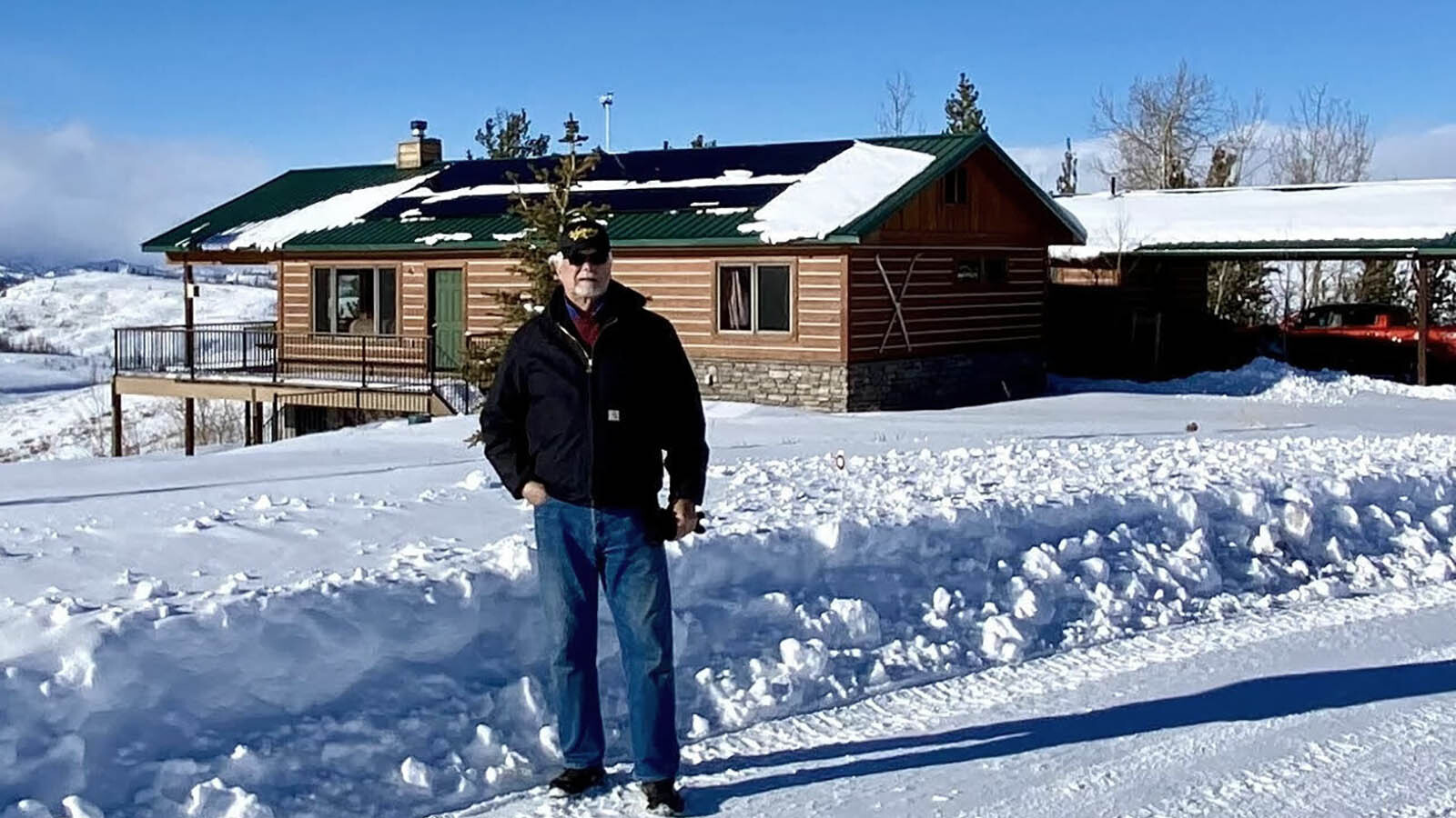 Jim Jacobson stands in front of his home in Bondurant, Wyoming. He said his property taxes have more than doubled from 2020-2023.